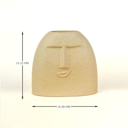Ceramic face-shaped vase with measurements on a white background