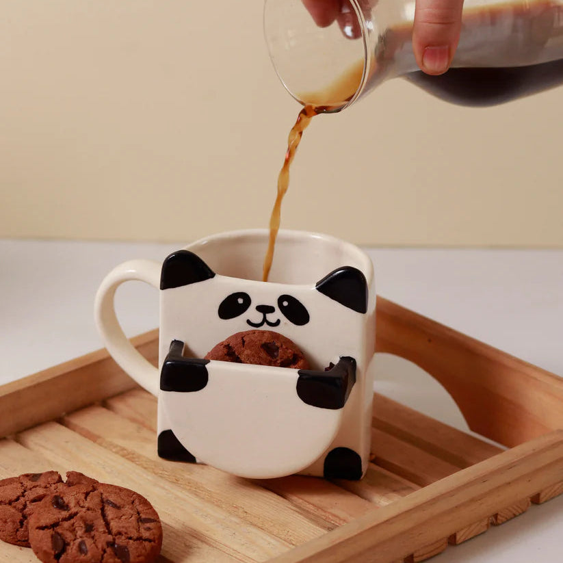 Panda mug with cookies on a wooden tray