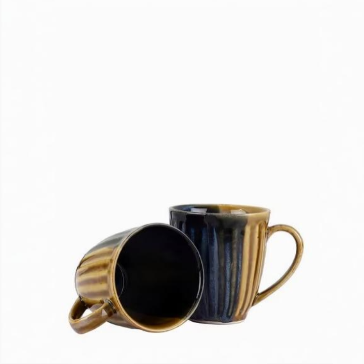 Two ceramic mugs with striped design on a white background